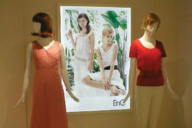 Manequins advertising clothing on snap frame